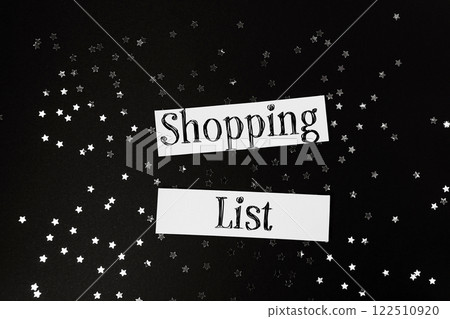 Shopping list is written on a piece of paper with stars scattered around it Shopping list is written on a piece of paper with stars scattered around it 122510920
