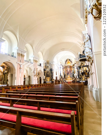 The church is empty and the pews are red The church is empty and the pews are red 122510932