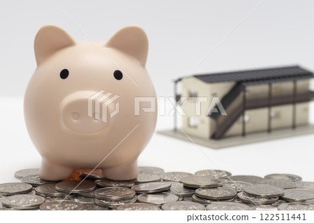 Pig money box, apartment house and mortgage with coins Pig money box, apartment house and mortgage with coins 122511441