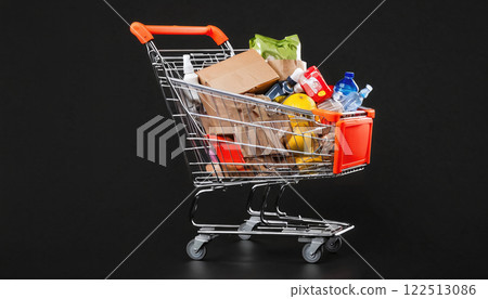 Illustrative depiction of a full shopping cart, free standing in front of a background of the same color, consumption and shopping pleasure - ai generated 122513086