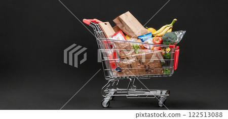Illustrative depiction of a full shopping cart, free standing in front of a background of the same color, consumption and shopping pleasure - ai generated 122513088