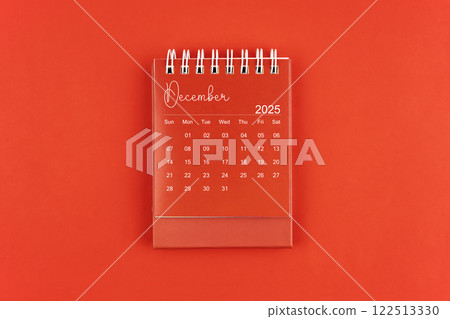 December 2025 red color desk calendar on red  background. 122513330