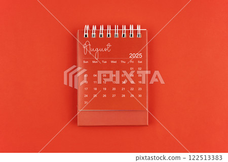 August 2025 red color desk calendar on red  background. 122513383
