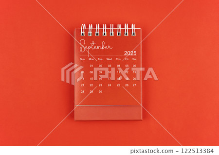 September 2025 red color desk calendar on red background. September 2025 red color desk calendar on red background. 122513384
