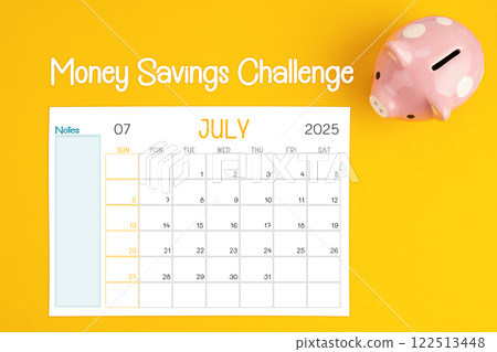 July 2025 calendar and piggy bank. Money savings challenge concepts. 122513448