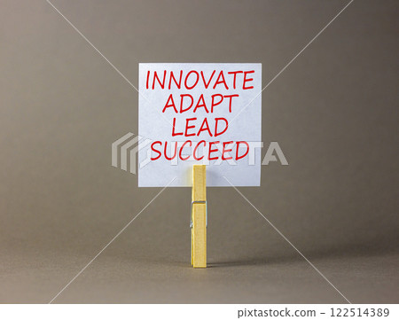 Innovate adapt lead succeed symbol. Concept words Innovate Adapt Lead Succeed on beautiful white paper. Beautiful grey background. Business innovate adapt lead succeed concept. Copy space. Innovate adapt lead succeed symbol. Concept words Innovate Adapt Lead Succeed on beautiful white paper. Beautiful grey background. Business innovate adapt lead succeed concept. Copy space. 122514389