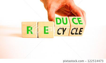 Reduce or recycle symbol. Concept words Reduce Recycle on wooden block. Beautiful white table white background. Businessman hand. Business reduce or recycle concept. Copy space. Reduce or recycle symbol. Concept words Reduce Recycle on wooden block. Beautiful white table white background. Businessman hand. Business reduce or recycle concept. Copy space. 122514473
