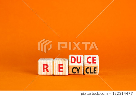 Reduce or recycle symbol. Concept words Reduce Recycle on wooden block. Beautiful orange table orange background. Business reduce or recycle concept. Copy space. 122514477