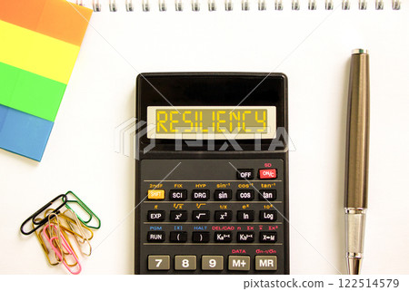 Resiliency symbol. Concept word Resiliency on beautiful black calculator. Beautiful white paper background. Beautiful black pen. Colored paper. Business resiliency concept. Copy space. 122514579