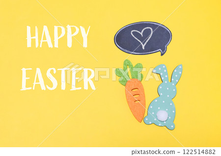 Yellow background with a carrot and a rabbit on it 122514882