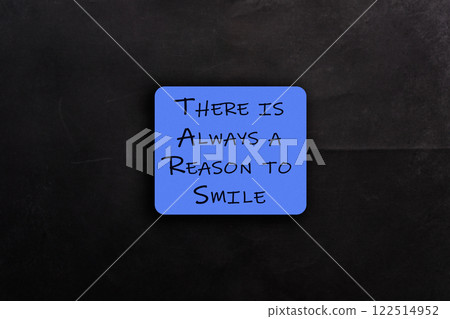 Blue sign that says There is always a reason to smile 122514952