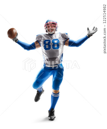 Sportsman in action. American football. Young strong and agile American football player shows his superiority. Strong position. Sports emotions Sportsman in action. American football. Young strong and agile American football player shows his superiority. Strong position. Sports emotions 122514982