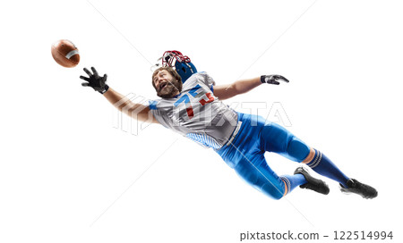 American football player catches the ball in the air. Sport emotion. Falls and tries to reach the ball. Sportsman in action. American football. Isolated 122514994