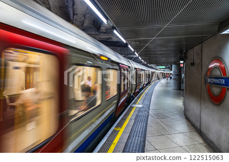 London Underground Train in Motion. Iconic Tube Station with Dynamic Urban Atmosphere 122515063