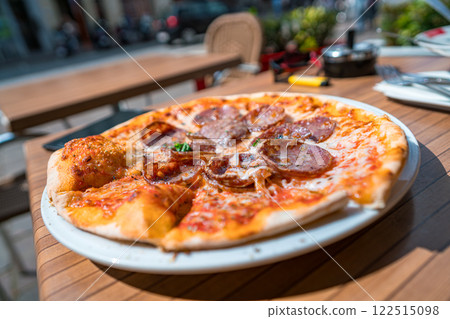 Pizza on the table of a street cafe 122515098