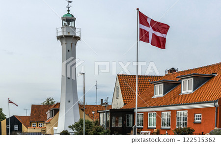 Lighthouse with the Danish flag in a small town Ronne, Bornholm, Denmark Lighthouse with the Danish flag in a small town Ronne, Bornholm, Denmark 122515362