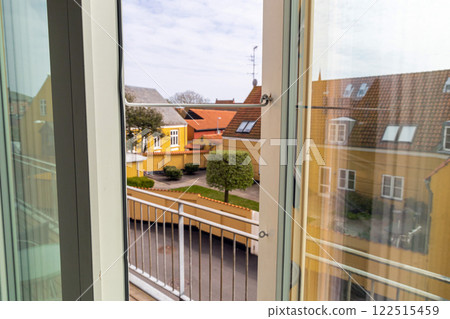 Open window overlooking the street on a summer day Open window overlooking the street on a summer day 122515459