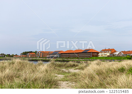 Natural beach with sand and grass in the town of Ronne on the Bornholm Island, Denmark 122515485