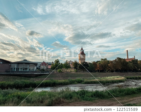 City with a large tower in the background 122515589