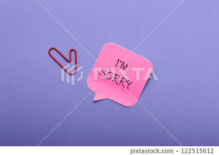 a blue background with a pink note that says I'm sorry. 122515612