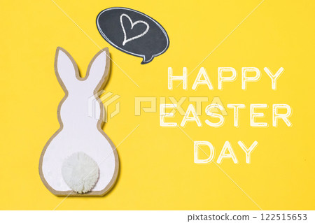 Rabbit with a heart on it is on a yellow background Rabbit with a heart on it is on a yellow background 122515653