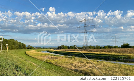 Field with a power line running through it 122515701