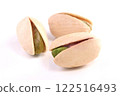 3 green pistachios on a white background 122516493