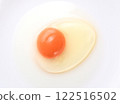 Raw egg shot from directly above on white background 122516502