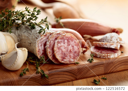 Dry-cured sausage with thyme, garlic, and onion. Dry-cured sausage with thyme, garlic, and onion. 122516572