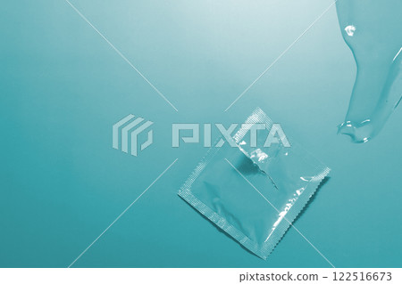 Condom in open package, lubricant. Image can be used as background Condom in open package, lubricant. Image can be used as background 122516673