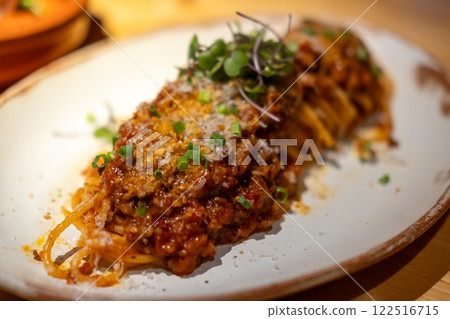 Spaghetti Bolognese, a meat-based sauce in Italian cuisine. served on plate Spaghetti Bolognese, a meat-based sauce in Italian cuisine. served on plate 122516715