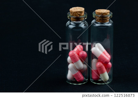 glass jar with colorful pills 122516873
