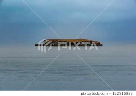 A small island off the coast of Hofn in eastern Iceland. A small island off the coast of Hofn in eastern Iceland. 122516883