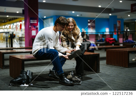 Couple enjoying a cozy moment at a leisure center in evening hours 122517236