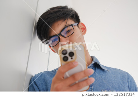 Young architect sketching house plans on a work desk in a modern office 122517334