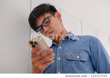 Young architect sketching house plans on a work desk in a modern office 122517335