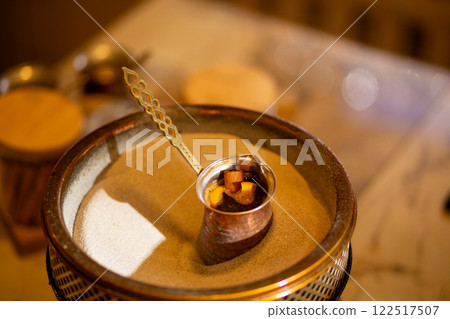 Preparation of Turkish coffee in the cezve in the sand. Preparation of Turkish coffee in the cezve in the sand. 122517507
