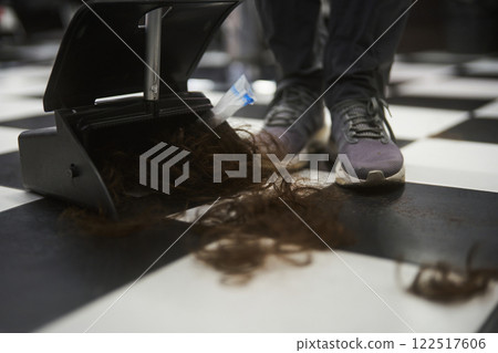 Hair clippings on the floor at a busy barber shop during a haircut session 122517606