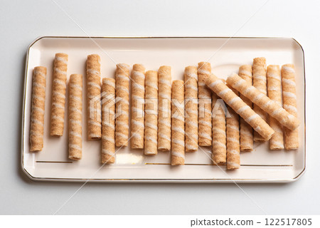 Crunchy Rolled Wafer Sticks on Elegant Tray 122517805