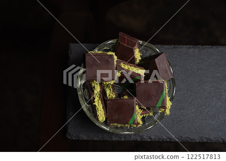 Delicious Dark Chocolate with Pistachio Filling. Viral dubai chocolate Delicious Dark Chocolate with Pistachio Filling. Viral dubai chocolate 122517813