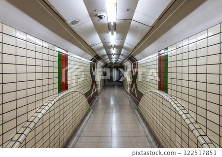 Symmetrical Underground Subway Tunnel with Classic Tiled Walls in London 122517851