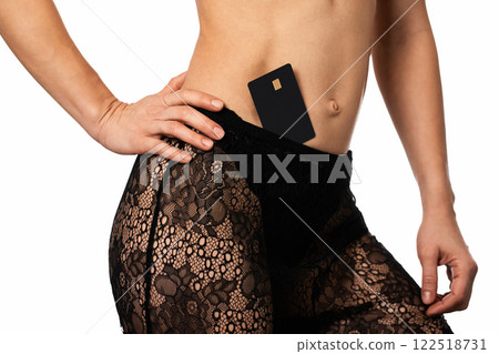woman in lingerie underwear with black premium credit bank card on white background. money concept 122518731