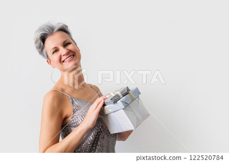 Smiling happy lady 50 years old with gray hair and short haircut looking at camera 122520784