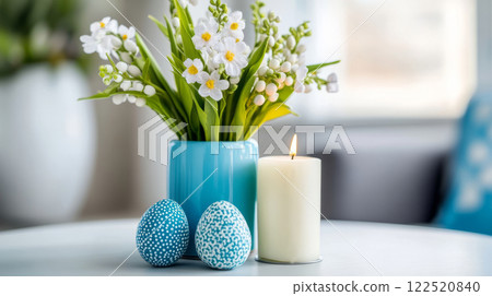 Elegant Easter Lily Bouquet, Candle, and Dotted Blue Eggs on White Table in Bright Interior Elegant Easter Lily Bouquet, Candle, and Dotted Blue Eggs on White Table in Bright Interior 122520840