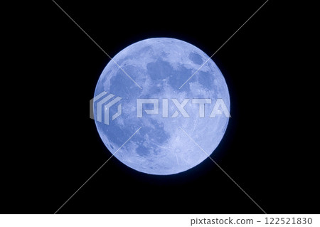 Blue moon floating in the night sky Blue moon floating in the night sky 122521830