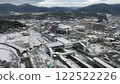 Aerial view of Nishitakaya New Station building in Higashihiroshima city in snow 122522226