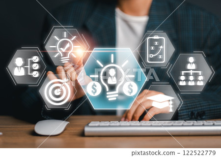 A dynamic image depicting an entrepreneur interacting with digital business icons, symbolizing innovation and modern startup strategies. 122522779