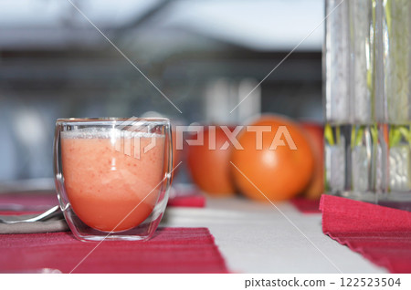 A glass of fresh juice on table. Healthy food. 122523504