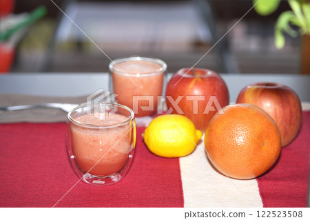 A glass of fresh juice on table. Healthy food. A glass of fresh juice on table. Healthy food. 122523508