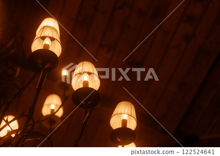 A group of lamps with a warm glow 122524641